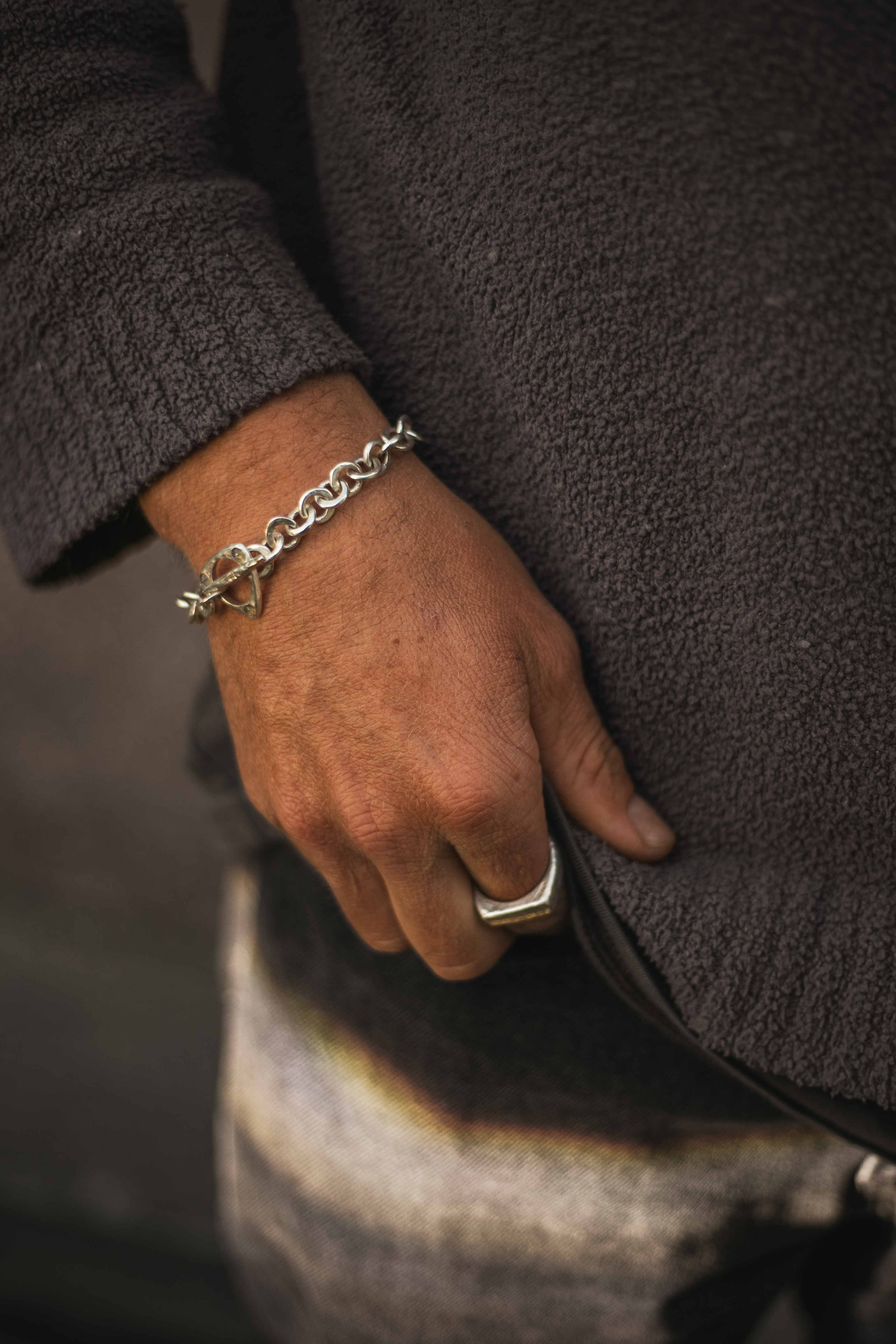 Chain bracelet and ring, worn